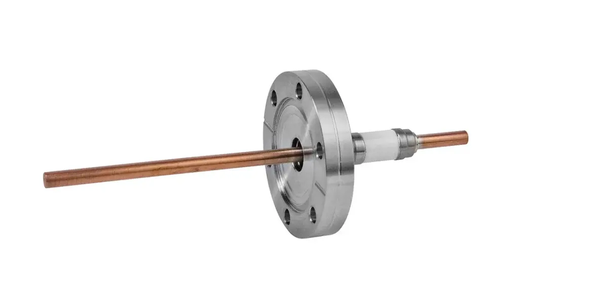 Electrical feedthrough with a copper wire conductor insulated by ceramic, mounted on a circular metal flange with bolt holes